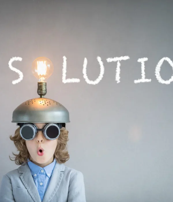 Portrait of child in classroom. Kid with toy virtual reality headset in class. Success, idea and innovation technology concept. Back to school